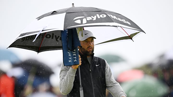 Scottie Scheffler opened with a 3-under 68 in off-and-on rain at Royal Portrush.