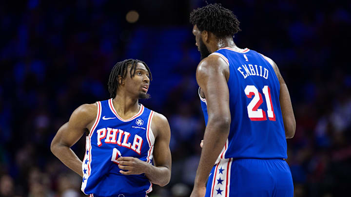 Jan 15, 2024; Philadelphia, Pennsylvania, USA; Philadelphia 76ers center Joel Embiid (21) and guard Tyrese Maxey (0) talk during a break in action in the first quarter against the Houston Rockets at Wells Fargo Center. Mandatory Credit: Bill Streicher-Imagn Images