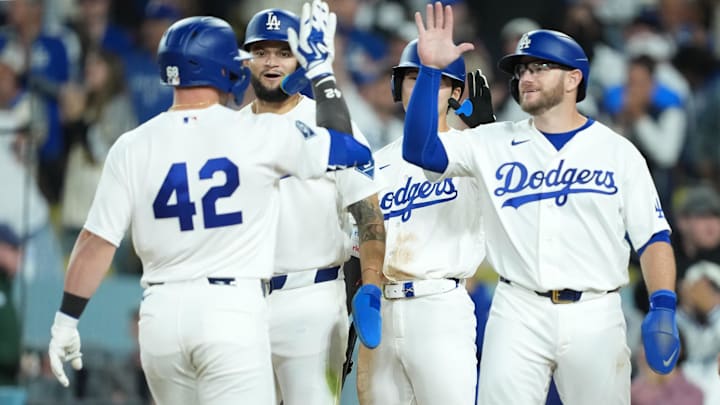 Los Angeles Dodgers catcher Dalton Rushing (left) celebrates with center fielder Andy Pages, Hyeseong Kim and Max Mundy after hitting a grand slam home run in the eighth inning against the New York Mets at Dodger Stadium on April 15.