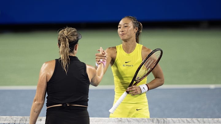 Aug 16, 2024; Cincinnati, OH, USA; Anastasia Pavlyuchenkova at the net with Qinwen Zheng  of China after their match on day five of the Cincinnati Open.