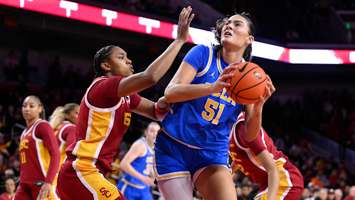Feb 13, 2025; Los Angeles, California, USA; UCLA Bruins center Lauren Betts (51) drives to the basket as guard Aaliyah Gayles (3) defends during the first quarter at Galen Center. Mandatory Credit: Robert Hanashiro-Imagn Images Feb 13, 2025; Los Angeles, California, USA; UCLA Bruins center Lauren Betts (51) drives to the basket as guard Aaliyah Gayles (3) defends during the first quarter at Galen Center. Mandatory Credit: Robert Hanashiro-Imagn Images