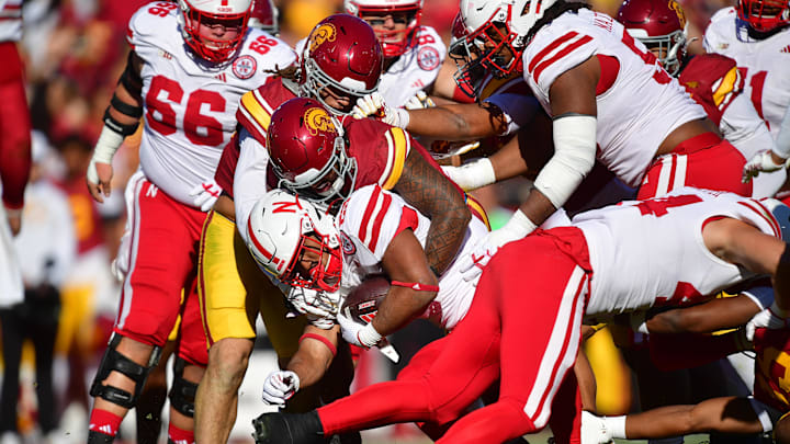 Nebraska Cornhuskers running back Dante Dowdell is brought down by the Southern California Trojans' defense. Nebraska Cornhuskers running back Dante Dowdell is brought down by the Southern California Trojans' defense.