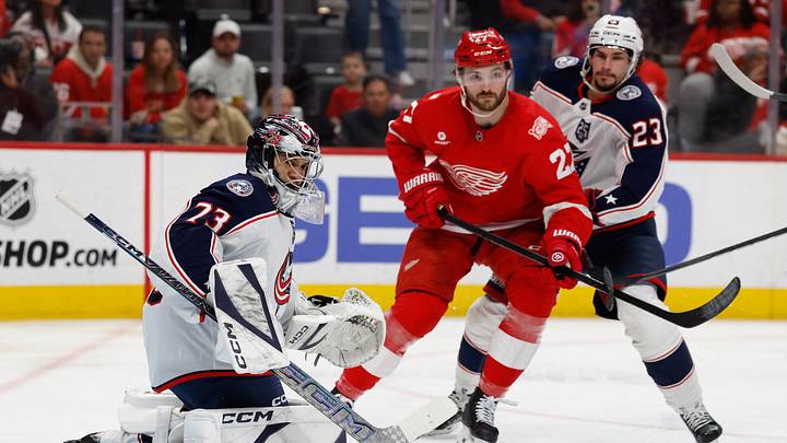 Apr 7, 2026; Detroit, Michigan, USA; Columbus Blue Jackets goaltender Jet Greaves (73) makes a save in front of Detroit Red Wings center Michael Rasmussen (27) in the second period at Little Caesars Arena. Mandatory Credit: Rick Osentoski-Imagn Images Apr 7, 2026; Detroit, Michigan, USA; Columbus Blue Jackets goaltender Jet Greaves (73) makes a save in front of Detroit Red Wings center Michael Rasmussen (27) in the second period at Little Caesars Arena. Mandatory Credit: Rick Osentoski-Imagn Images