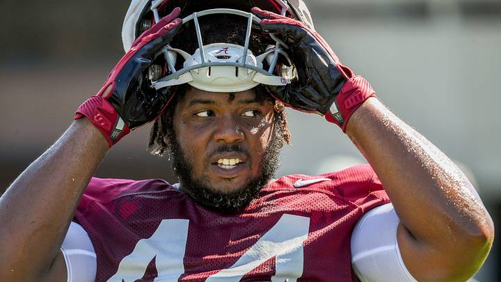 The Crimson Tide players and coaches continue working toward the season opener in practice Tuesday, Aug. 13, 2024. Alabama defensive lineman Damon Payne Jr. (44) takes a break.