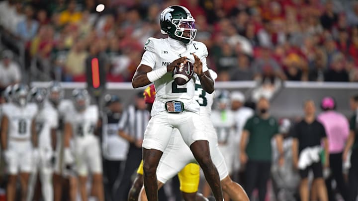 Sep 20, 2025; Los Angeles, California, USA; Michigan State Spartans quarterback Aidan Chiles (2) drops back to pass against the Southern California Trojans during the first half at the Los Angeles Memorial Coliseum. Mandatory Credit: Gary A. Vasquez-Imagn Images Sep 20, 2025; Los Angeles, California, USA; Michigan State Spartans quarterback Aidan Chiles (2) drops back to pass against the Southern California Trojans during the first half at the Los Angeles Memorial Coliseum. Mandatory Credit: Gary A. Vasquez-Imagn Images
