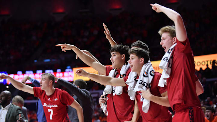 Feb 10, 2026; Champaign, Illinois, USA;  Wisconsin Badgers players react to a score during the second half against the Illinois Fighting Illini at State Farm Center. Mandatory Credit: Ron Johnson-Imagn Images