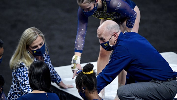 Apr 16, 2021; Fort Worth, Texas, USA; University of Michigan Wolverines gymnastics team head coach Bev Plocki and assistant coach Scott Sherman during the 2021 NCAA Women Gymnastics Championships at Dickies Arena. Mandatory Credit: Jerome Miron-Imagn Images