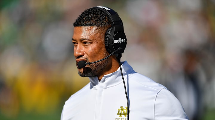 Sep 7, 2024; South Bend, Indiana, USA; Notre Dame Fighting Irish head coach Marcus Freeman walks to the sideline in the second quarter against the Northern Illinois Huskies at Notre Dame Stadium. Mandatory Credit: Matt Cashore-Imagn Images