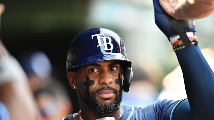 Sep 13, 2025; Chicago, Illinois, USA; Tampa Bay Rays designated hitter Yandy Diaz (2) celebrates with teammates in the dugout after scoring against the Chicago Cubs during a game at Wrigley Field. Mandatory Credit: Patrick Gorski-Imagn Images