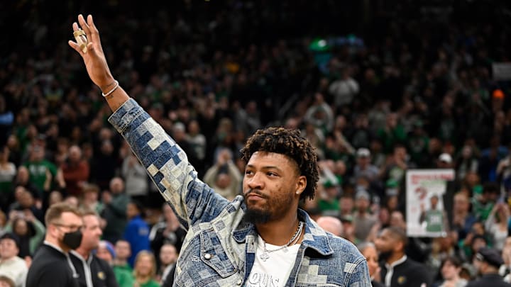 Feb 4, 2024; Boston, Massachusetts, USA;  Memphis Grizzlies guard Marcus Smart (36)  waves to fans during the first half against the Boston Celtics at TD Garden. Mandatory Credit: Eric Canha-Imagn Images