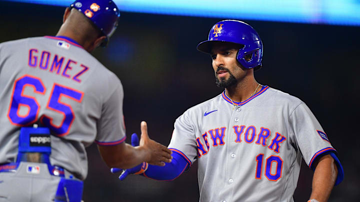 May 1, 2026; Anaheim, California, USA; New York Mets second baseman Marcus Semien (10) is greeted by first base & outfield coach Gilbert Gomez (65) after hitting a two run RBI single aganist the Los Angeles Angels during the sixth inning at Angel Stadium. Mandatory Credit: Gary A. Vasquez-Imagn Images
