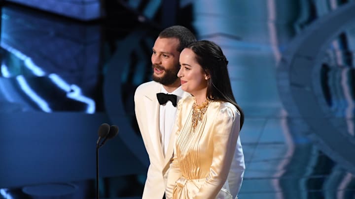 Feb 26, 2017; Hollywood, CA, USA; Jamie Dornan (L) and Dakota Johnson present the award for