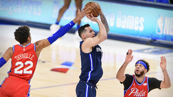 Apr 12, 2021; Dallas, Texas, USA; Dallas Mavericks guard JJ Redick (17) attempts a three point shot between Philadelphia 76ers guard Matisse Thybulle (22) and guard Seth Curry (31) during the first quarter at the American Airlines Center. Mandatory Credit: Jerome Miron-Imagn Images