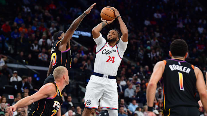 Oct 31, 2024; Inglewood, California, USA; Los Angeles Clippers guard Norman Powell (24) shoots against Phoenix Suns forward Royce O'Neale (00) during the second half at Intuit Dome. Mandatory Credit: Gary A. Vasquez-Imagn Images Oct 31, 2024; Inglewood, California, USA; Los Angeles Clippers guard Norman Powell (24) shoots against Phoenix Suns forward Royce O'Neale (00) during the second half at Intuit Dome. Mandatory Credit: Gary A. Vasquez-Imagn Images