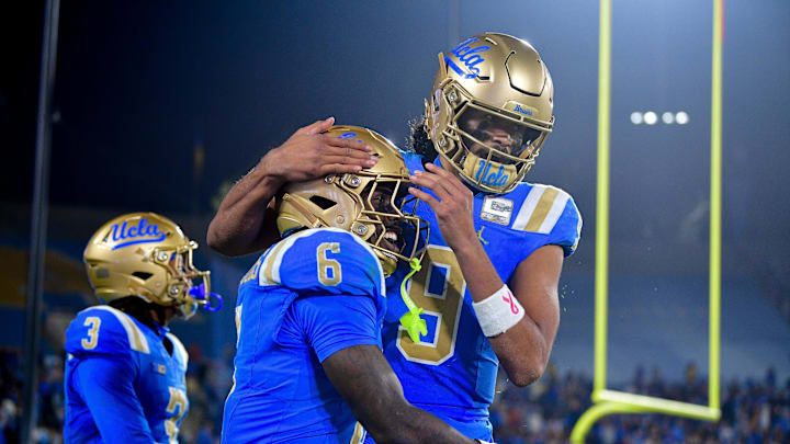 Nov 8, 2025; Pasadena, California, USA; UCLA Bruins running back Anthony Woods (6) celebrates his touchdown scored against the Nebraska Cornhuskers with quarterback Nico Iamaleava (9) during the second half at the Rose Bowl. Mandatory Credit: Gary A. Vasquez-Imagn Images Nov 8, 2025; Pasadena, California, USA; UCLA Bruins running back Anthony Woods (6) celebrates his touchdown scored against the Nebraska Cornhuskers with quarterback Nico Iamaleava (9) during the second half at the Rose Bowl. Mandatory Credit: Gary A. Vasquez-Imagn Images