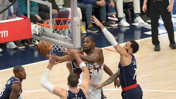 Phoenix Suns forward Kevin Durant (35) shoots the ball against LA Clippers center Ivica Zubac (40) and guard Amir Coffey (7) in the first half at Intuit Dome. Mandatory Credit: Kirby Lee-Imagn Images