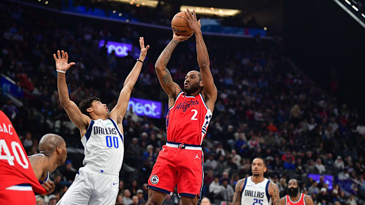Apr 4, 2025; Inglewood, California, USA; Los Angeles Clippers forward Kawhi Leonard (2) shoots against Dallas Mavericks guard Max Christie (00) during the first half at Intuit Dome. Mandatory Credit: Gary A. Vasquez-Imagn Images