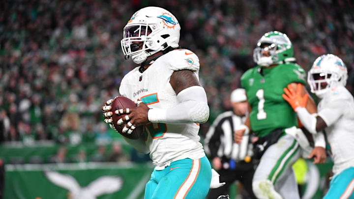 Miami Dolphins linebacker Jerome Baker (55) returns an interception for a touchdown  during the third quarter against the Philadelphia Eagles at Lincoln Financial Field during the 2023 season.