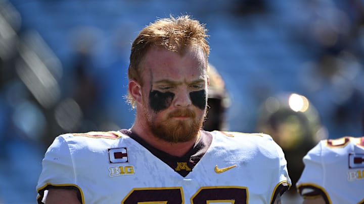 Sep 16, 2023; Chapel Hill, North Carolina, USA;  Minnesota Golden Gophers offensive lineman Quinn Carroll (77) on the field before the game at Kenan Memorial Stadium. Mandatory Credit: Bob Donnan-Imagn Images