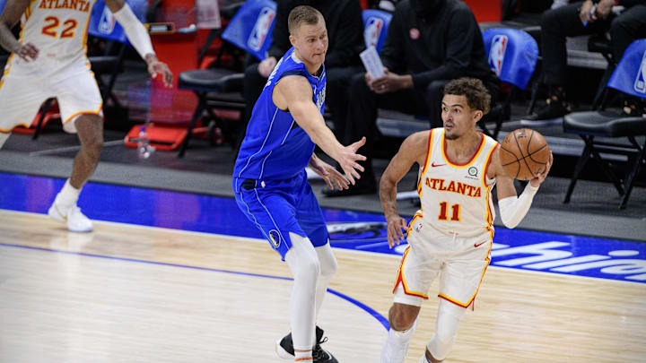 Feb 10, 2021; Dallas, Texas, USA; Dallas Mavericks forward Kristaps Porzingis (6) and Atlanta Hawks guard Trae Young (11) in action during the game between the Dallas Mavericks and the Atlanta Hawks at the American Airlines Center. Mandatory Credit: Jerome Miron-Imagn Images