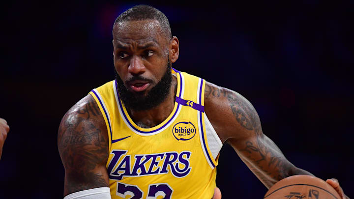 Dec 31, 2024; Los Angeles, California, USA; Los Angeles Lakers forward LeBron James (23) moves the ball against the Cleveland Cavaliers during the first half at Crypto.com Arena. Mandatory Credit: Gary A. Vasquez-Imagn Images Dec 31, 2024; Los Angeles, California, USA; Los Angeles Lakers forward LeBron James (23) moves the ball against the Cleveland Cavaliers during the first half at Crypto.com Arena. Mandatory Credit: Gary A. Vasquez-Imagn Images