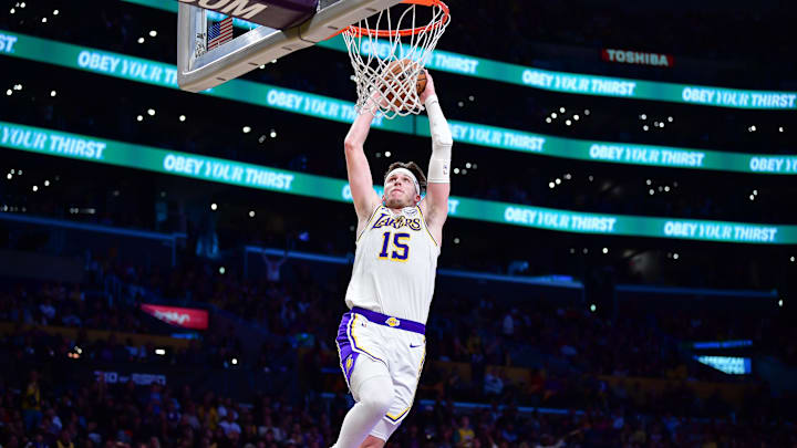 Feb 8, 2025; Los Angeles, California, USA; Los Angeles Lakers guard Austin Reaves (15) dunks for the basket against the Indiana Pacers during the second half at Crypto.com Arena. Mandatory Credit: Gary A. Vasquez-Imagn Images