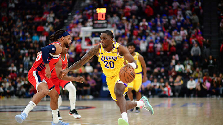 Feb 4, 2025; Inglewood, California, USA; Los Angeles Lakers guard Shake Milton (20) moves the ball against Los Angeles Clippers guard Patty Mills (88) during the second half at Intuit Dome. Mandatory Credit: Gary A. Vasquez-Imagn Images