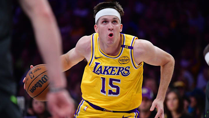 Apr 30, 2025; Los Angeles, California, USA; Los Angeles Lakers guard Austin Reaves (15) moves to the basket against the Minnesota Timberwolves during the first half in game five of first round for the 2025 NBA Playoffs at Crypto.com Arena. Mandatory Credit: Gary A. Vasquez-Imagn Images