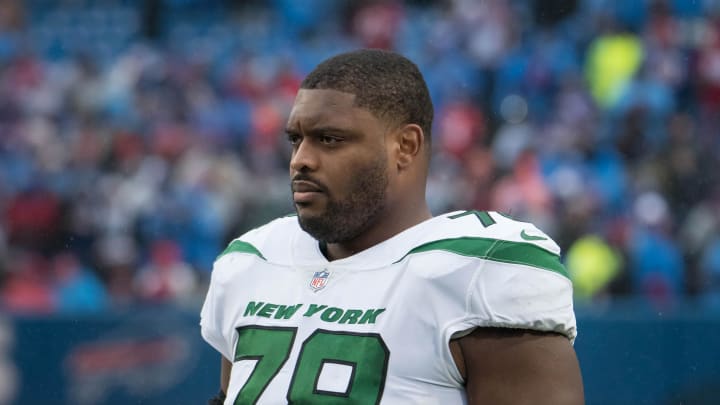 Dec 11, 2022; Orchard Park, New York, USA; New York Jets guard Laken Tomlinson (78) on the sidelines before a game against the Buffalo Bills at Highmark Stadium. Mandatory Credit: Mark Konezny-USA TODAY Sports Dec 11, 2022; Orchard Park, New York, USA; New York Jets guard Laken Tomlinson (78) on the sidelines before a game against the Buffalo Bills at Highmark Stadium. Mandatory Credit: Mark Konezny-USA TODAY Sports