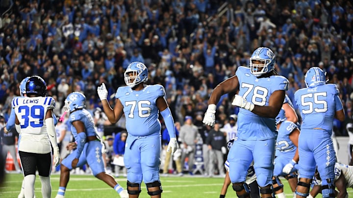 Nov 11, 2023; Chapel Hill, North Carolina, USA; North Carolina Tar Heels offensive lineman William Barnes (76) and Trevyon Green (78) react after a field goal to tie the game in the fourth quarter at Kenan Memorial Stadium. Nov 11, 2023; Chapel Hill, North Carolina, USA; North Carolina Tar Heels offensive lineman William Barnes (76) and Trevyon Green (78) react after a field goal to tie the game in the fourth quarter at Kenan Memorial Stadium.