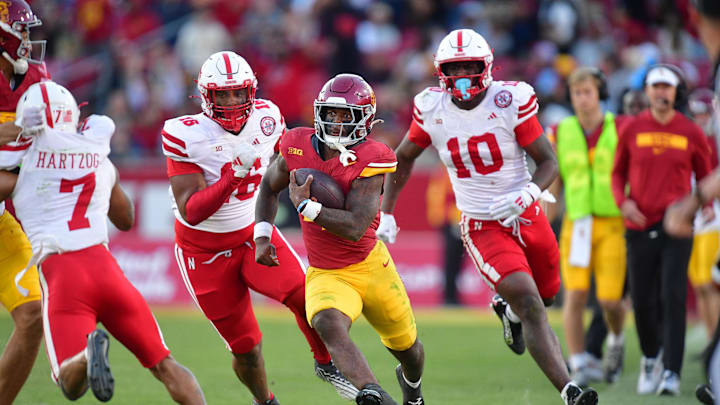 Nov 16, 2024; Los Angeles, California, USA; Southern California Trojans running back Woody Marks (4) runs the ball ahead of Nebraska Cornhuskers defensive lineman Elijah Jeudy (16) during the second half at the Los Angeles Memorial Coliseum. Mandatory Credit: Gary A. Vasquez-Imagn Images