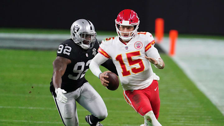 Nov 22, 2020; Paradise, Nevada, USA; Kansas City Chiefs quarterback Patrick Mahomes (15) is pursued by Las Vegas Raiders defensive end Chris Smith (92) at Allegiant Stadium. Mandatory Credit: Kirby Lee-Imagn Images