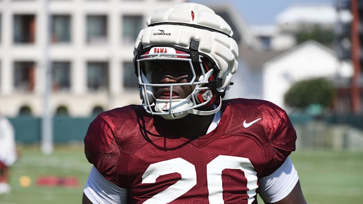 The Crimson Tide players and coaches work during practice Tuesday, Aug. 6, 2024. Alabama defensive lineman Jah-Marien Latham (20) moves between turns in a drill.