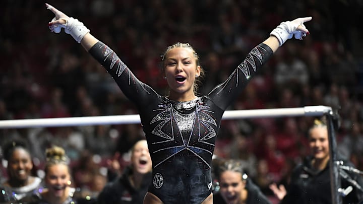 Feb.2, 2024; Tuscaloosa, Alabama, USA; Alabama gymnast Cam Machado sticks her dismount from the bars