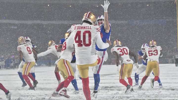 Dec 1, 2024; Orchard Park, New York, USA; San Francisco 49ers punter Pat O'Donnell (40) nearly has his punt blocked by Buffalo Bills tight end Zach Davidson (84) in the third quarter at Highmark Stadium.