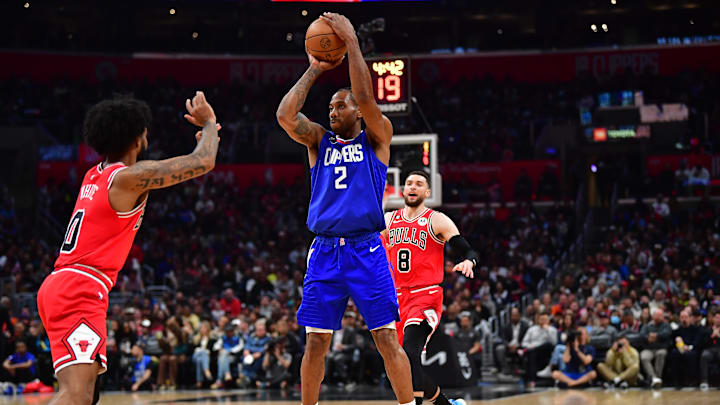 Mar 27, 2023; Los Angeles, California, USA; Los Angeles Clippers forward Kawhi Leonard (2) shoots against Chicago Bulls guard Coby White (0) during the second half at Crypto.com Arena. Mandatory Credit: Gary A. Vasquez-Imagn Images