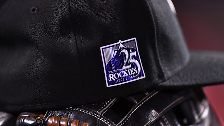 Sep 25, 2018; Denver, CO, USA; General view of Colorado Rockies center fielder Charlie Blackmon (19) (not pictured) cap and glove with the 25th anniversary logo during the game against the Philadelphia Phillies at Coors Field.