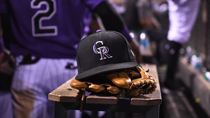 Aug 4, 2017; Denver, CO, USA; General view of the hat and glove of Colorado Rockies shortstop Pat Valaika (4) (not pictured) in the seventh inning against the Philadelphia Phillies at Coors Field. 