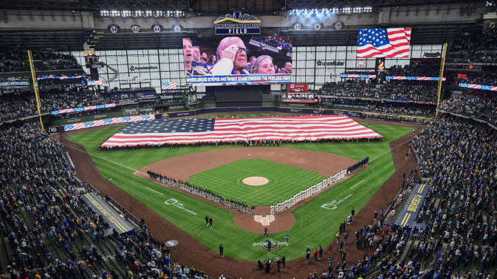 Apr 2, 2024; Milwaukee, Wisconsin, USA; Players and fans stand for the National Anthem before game between the Milwaukee Brewers and Minnesota Twins at American Family Field.