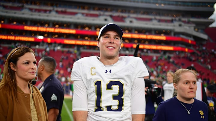 Nov 30, 2024; Los Angeles, California, USA; Notre Dame Fighting Irish quarterback Riley Leonard (13) reacts following the victory against the Southern California Trojans during the second half at the Los Angeles Memorial Coliseum.  