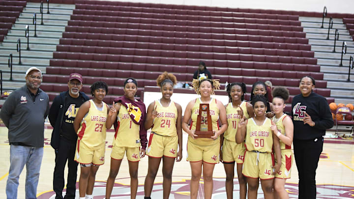 Lake Gibson won its fourth district title game in eight years after defeating No. 1 seed St. Cloud on Friday, Feb. 3, 2023, at St. Cloud High School. From left to right are the following: Coach Marquis Roberts, Mr. Terry Coney (stats), Jakhia Willis, Taniya Brown, Camryn Wiggins, Samari Wilson, Jamila Ray, Kamryn Veasy (No. 50), Talea Turner, Deondrea Arrington and Coach Antonia Bennett.
Dsc 0527 Lake Gibson won its fourth district title game in eight years after defeating No. 1 seed St. Cloud on Friday, Feb. 3, 2023, at St. Cloud High School. From left to right are the following: Coach Marquis Roberts, Mr. Terry Coney (stats), Jakhia Willis, Taniya Brown, Camryn Wiggins, Samari Wilson, Jamila Ray, Kamryn Veasy (No. 50), Talea Turner, Deondrea Arrington and Coach Antonia Bennett.
Dsc 0527