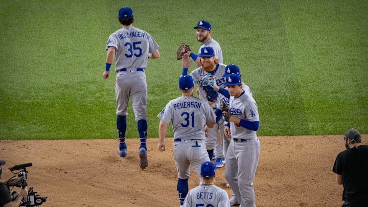 Oct 16, 2020; Arlington, Texas, USA; Los Angeles Dodgers right fielder Mookie Betts (50) and center fielder Cody Bellinger (35) and designated hitter Joc Pederson (31) and third baseman Justin Turner (10) and second baseman Chris Taylor (3) and shortstop Corey Seager (5) celebrate the win over the Atlanta Braves in game five of the 2020 NLCS at Globe Life Field. Mandatory Credit: Jerome Miron-Imagn Images