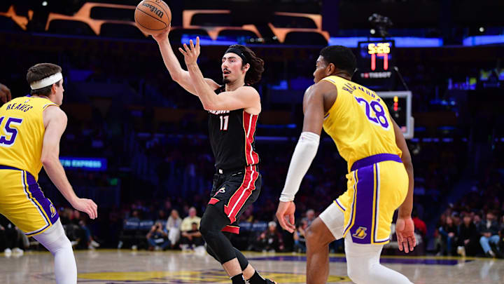 January 15, 2025; Los Angeles, California, USA; Miami Heat guard Jaime Jaquez Jr. (11) passes the ball against Los Angeles Lakers guard Austin Reaves (15) and forward Rui Hachimura (28) during the first half at Crypto.com Arena. Mandatory Credit: Gary A. Vasquez-Imagn Images January 15, 2025; Los Angeles, California, USA; Miami Heat guard Jaime Jaquez Jr. (11) passes the ball against Los Angeles Lakers guard Austin Reaves (15) and forward Rui Hachimura (28) during the first half at Crypto.com Arena. Mandatory Credit: Gary A. Vasquez-Imagn Images