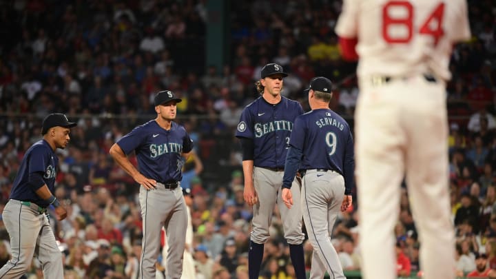 Seattle Mariners manager Scott Servais (9) relives starting pitcher Logan Gilbert (36) of the ball during the third inning against the Boston Red Sox at Fenway Park on July 29. Seattle Mariners manager Scott Servais (9) relives starting pitcher Logan Gilbert (36) of the ball during the third inning against the Boston Red Sox at Fenway Park on July 29.