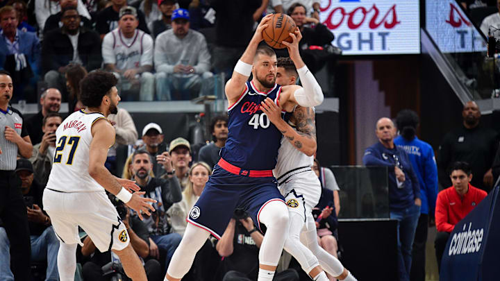 Apr 24, 2025; Inglewood, California, USA; Los Angeles Clippers center Ivica Zubac (40) moves to the basket against Denver Nuggets forward Michael Porter Jr. (1) during the first half of game three in the first round for the 2024 NBA Playoffs at Intuit Dome. Mandatory Credit: Gary A. Vasquez-Imagn Images Apr 24, 2025; Inglewood, California, USA; Los Angeles Clippers center Ivica Zubac (40) moves to the basket against Denver Nuggets forward Michael Porter Jr. (1) during the first half of game three in the first round for the 2024 NBA Playoffs at Intuit Dome. Mandatory Credit: Gary A. Vasquez-Imagn Images