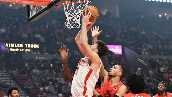 Jan 18, 2025; Portland, Oregon, USA;  Houston Rockets center Alperen Sengun (28) drives to the hoop against Portland Trail Blazers forward Toumani Camara (33) during the first half at Moda Center. Mandatory Credit: Brian Murphy-Imagn Images