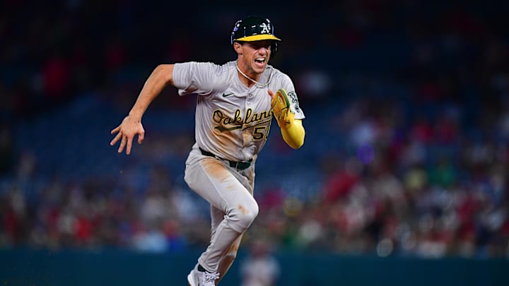 Jun 25, 2024; Anaheim, California, USA; Oakland Athletics third baseman Armando Alvarez (50) runs to third on a pickoff error by Los Angeles Angels pitcher Ben Joyce (44) during the eighth inning at Angel Stadium. Mandatory Credit: Gary A. Vasquez-Imagn Images