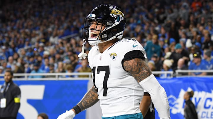 Dec 4, 2022; Detroit, Michigan, USA; Jacksonville Jaguars tight end Evan Engram (17) celebrates after catching a touchdown pass from quarterback Trevor Lawrence (not pictured) against the Detroit Lions in the third quarter at Ford Field. Mandatory Credit: Lon Horwedel-Imagn Images