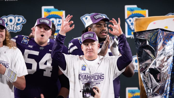 Dec 28, 2023; Orlando, FL, USA; Kansas State head coach Chris Klieman celebrates the victory over NC State after the game at Camping World Stadium. Mandatory Credit: Jeremy Reper-USA TODAY Sports Dec 28, 2023; Orlando, FL, USA; Kansas State head coach Chris Klieman celebrates the victory over NC State after the game at Camping World Stadium. Mandatory Credit: Jeremy Reper-USA TODAY Sports