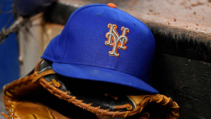 Jul 13, 2019; Miami, FL, USA; A general view of a New York Mets hat and glove on the steps of the dugout in the game between the Miami Marlins and the New York Mets at Marlins Park. Mandatory Credit: Jasen Vinlove-Imagn Images
